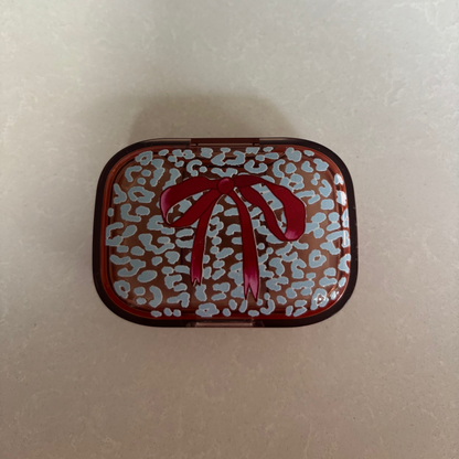 Ice Blue Leopard with Burgundy Bow on Peach Pill Pot