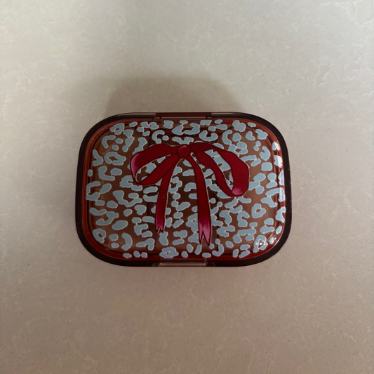 Ice Blue Leopard with Burgundy Bow on Peach Pill Pot